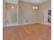 Open living area with tile floors and a view into the updated kitchen at 2480 S Glen Eagles Dr, Deland, FL 32724