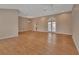 Spacious living room with wood floors, ceiling fans and lots of natural light at 2480 S Glen Eagles Dr, Deland, FL 32724