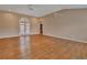 Large, bright living room with wood floors and a door to the outside at 2480 S Glen Eagles Dr, Deland, FL 32724
