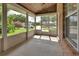 Screened patio with brick accent wall and view of street at 2480 S Glen Eagles Dr, Deland, FL 32724