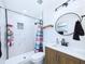 Bathroom featuring modern fixtures, marble tile, and a glass-enclosed shower at 2526 Victory Palm Dr, Edgewater, FL 32141