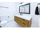 Renovated bathroom featuring black fixtures, a sleek vanity, and modern tile at 2526 Victory Palm Dr, Edgewater, FL 32141