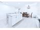 Bright kitchen with quartz counters and stainless appliances, an island and a dining area at 2526 Victory Palm Dr, Edgewater, FL 32141