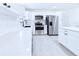 Modern kitchen features stainless steel appliances, white cabinets and subway tile backsplash at 2526 Victory Palm Dr, Edgewater, FL 32141