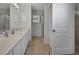 Bathroom featuring a white vanity and a view of the shower and closet at 25305 Mardon Cir, Paisley, FL 32767