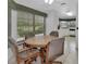 Sunny breakfast nook featuring a round table and comfortable seating at 25305 Mardon Cir, Paisley, FL 32767