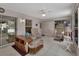 Enclosed lanai featuring tile floors, ceiling fan, and access to the outdoor space at 25305 Mardon Cir, Paisley, FL 32767