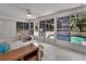 Screened-in lanai showcasing views of the pool and backyard at 25305 Mardon Cir, Paisley, FL 32767