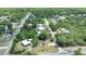 An aerial view showing the house nestled among lush greenery, with other residences nearby at 28045 Poinsettia Ave, Paisley, FL 32767