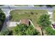 Aerial shot of a cozy home featuring mature trees, and a long driveway at 28045 Poinsettia Ave, Paisley, FL 32767