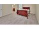 Bedroom with neutral walls, carpet and view to the vanity and en suite bathroom at 28045 Poinsettia Ave, Paisley, FL 32767