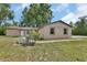 Charming single story home with a well-maintained lawn and landscaping at 28045 Poinsettia Ave, Paisley, FL 32767
