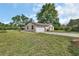 View of the side of the home with a two-car garage and driveway at 28045 Poinsettia Ave, Paisley, FL 32767