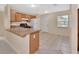 Kitchen with counter space, tile flooring and a view to the front door at 28045 Poinsettia Ave, Paisley, FL 32767