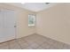 Small room features tile flooring, a window, and a closet at 28045 Poinsettia Ave, Paisley, FL 32767