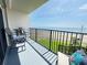 Outdoor balcony featuring chairs, table, and beautiful ocean view at 2860 Ocean Shore Blvd # 5020, Ormond Beach, FL 32176