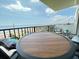 Balcony view showcasing the ocean and a table with two chairs at 2860 Ocean Shore Blvd # 5020, Ormond Beach, FL 32176