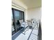 Cozy balcony seating overlooking the scenic beachfront at 2860 Ocean Shore Blvd # 5020, Ormond Beach, FL 32176