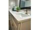 Bathroom vanity featuring granite countertop, white cabinets, and modern faucet at 2860 Ocean Shore Blvd # 5020, Ormond Beach, FL 32176