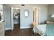 Bedroom featuring an organized closet, neutral walls, and wood-look floors at 2860 Ocean Shore Blvd # 5020, Ormond Beach, FL 32176