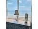 Beach view from bedroom with dresser, lamp, and decorative vase at 2860 Ocean Shore Blvd # 5020, Ormond Beach, FL 32176
