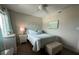 Cozy bedroom features cool toned walls with white trim, ceiling fan, and natural light at 2860 Ocean Shore Blvd # 5020, Ormond Beach, FL 32176