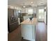 Bright open kitchen featuring an island, stainless steel appliances, and modern finishes at 2860 Ocean Shore Blvd # 5020, Ormond Beach, FL 32176