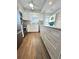 Modern white kitchen featuring an island and stainless steel appliances at 2860 Ocean Shore Blvd # 5020, Ormond Beach, FL 32176