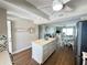 Open kitchen featuring a white island, stainless steel appliances, and dining area at 2860 Ocean Shore Blvd # 5020, Ormond Beach, FL 32176