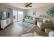 Bright living room with beach view, comfortable seating, and stylish decor at 2860 Ocean Shore Blvd # 5020, Ormond Beach, FL 32176