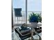 Coffee table decor featuring books, shell, and view of the ocean and balcony at 2860 Ocean Shore Blvd # 5020, Ormond Beach, FL 32176