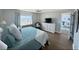 Serene main bedroom with beach view, light decor, and wood-look floors at 2860 Ocean Shore Blvd # 5020, Ormond Beach, FL 32176