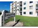 Leeward Winds Condominium building with well-maintained landscaping on a sunny day at 2860 Ocean Shore Blvd # 5020, Ormond Beach, FL 32176