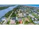 High-angle view of the home surrounded by water and other properties with pools at 3 Sea Dance Ter, Ormond Beach, FL 32176