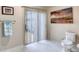Bathroom with a toilet, a towel rack, and a sliding glass door leading to the outside at 3 Sea Dance Ter, Ormond Beach, FL 32176