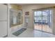 Bathroom featuring a glass shower enclosure and sliding glass doors leading to an outdoor space at 3 Sea Dance Ter, Ormond Beach, FL 32176