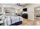 Cozy bedroom with a ceiling fan, a television, and plenty of sunlight at 3 Sea Dance Ter, Ormond Beach, FL 32176