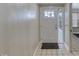A clean entryway with a white door, tile floors, and neutral paint at 3 Sea Dance Ter, Ormond Beach, FL 32176