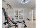 Exercise room with free weights and French doors, perfect for staying active at 3 Sea Dance Ter, Ormond Beach, FL 32176
