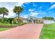 Charming single-story home with landscaped front yard, palm trees, and a driveway at 3 Sea Dance Ter, Ormond Beach, FL 32176