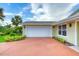 Exterior of the attached two-car garage, adjacent to a well landscaped yard at 3 Sea Dance Ter, Ormond Beach, FL 32176