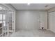 Neutral living room with large double doors and bright light from the windows at 3 Sea Dance Ter, Ormond Beach, FL 32176