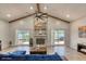 Spacious living room features vaulted ceiling with wood beams and a stone fireplace, filled with natural light at 3 Sea Dance Ter, Ormond Beach, FL 32176