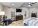 Large main bedroom with a ceiling fan, television, and an adjacent sitting area at 3 Sea Dance Ter, Ormond Beach, FL 32176