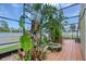 Enclosed patio featuring lush tropical landscaping and tile flooring at 3 Sea Dance Ter, Ormond Beach, FL 32176