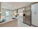 This kitchen has new stainless steel appliances and a large kitchen island at 302 Lafayette St, Port Orange, FL 32127