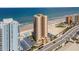Gorgeous aerial view of a beachfront condo, showcasing its pool, parking, and prime location near the ocean and coastal highway at 3051 S Atlantic Ave # 1003, Daytona Beach, FL 32118
