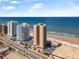 Breathtaking aerial view of the condo towers near the ocean, offering convenient access to the beach and the city at 3051 S Atlantic Ave # 1003, Daytona Beach, FL 32118