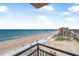 Expansive ocean views from the balcony with sandy beach below at 3051 S Atlantic Ave # 1003, Daytona Beach, FL 32118