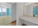 This bathroom offers a single sink vanity, tile flooring and a shared toilet and shower at 3051 S Atlantic Ave # 1003, Daytona Beach, FL 32118